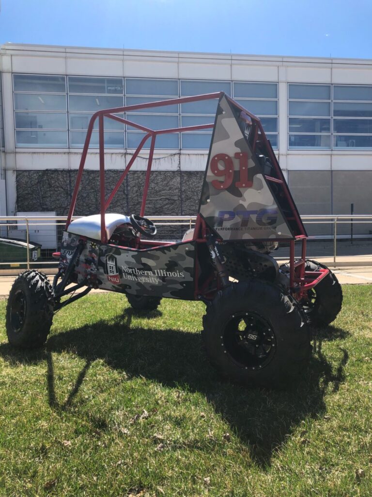 NIU Baja Team Vehicle With PTG Logo.